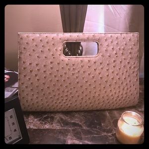 Beautiful faux ostrich skin clutch bag w/handle.